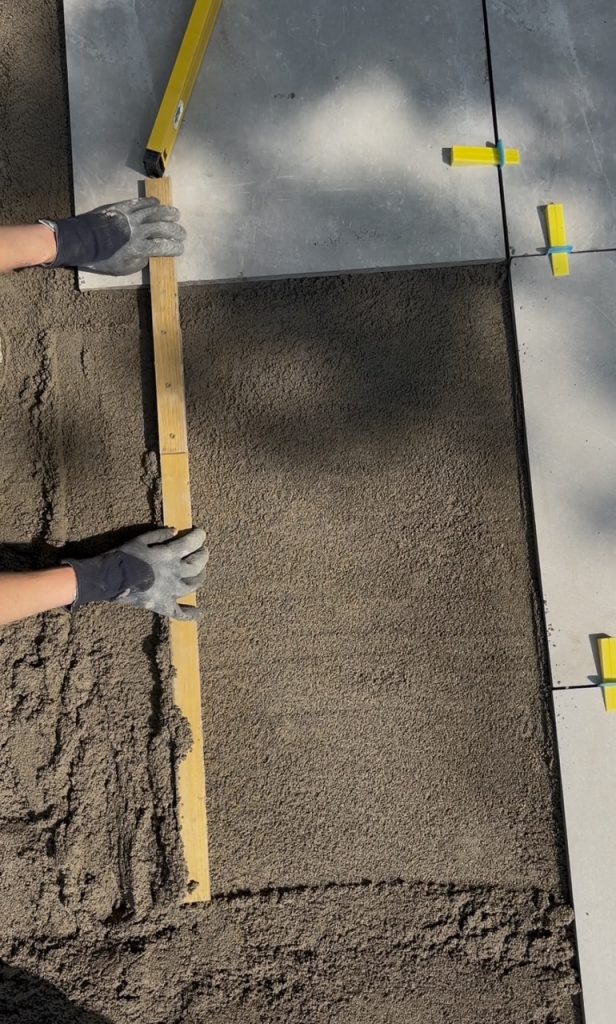laying mortar bed for diy porcelain patio