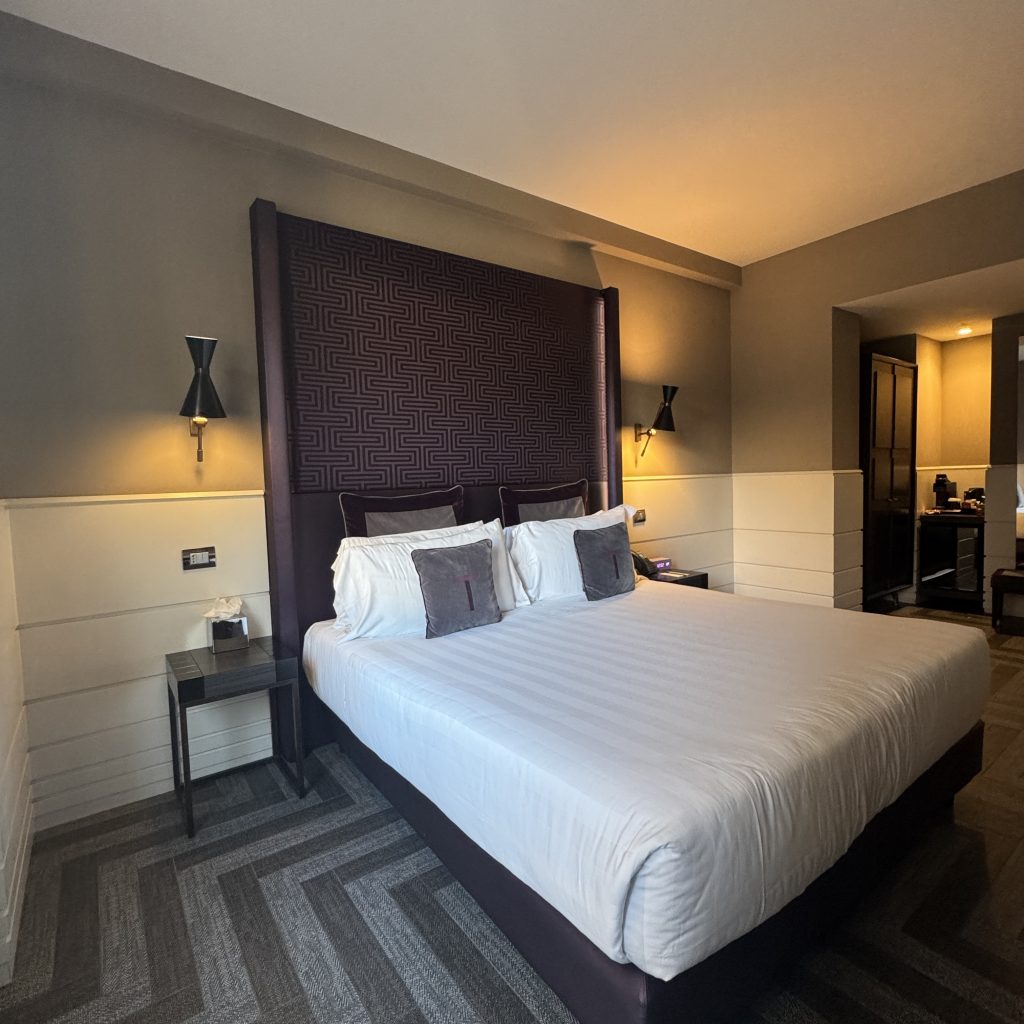 Bed in family room at the tribune hotel rome. 