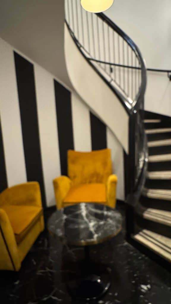 the Tribune Hotel, Rome seats at bottom of stairs