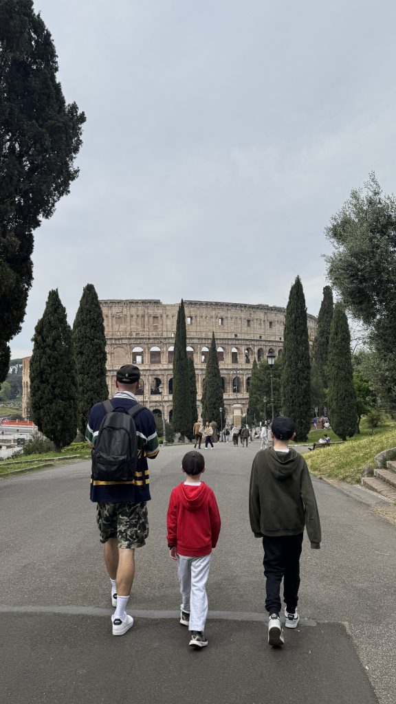 walking from the hotel to the colosseum