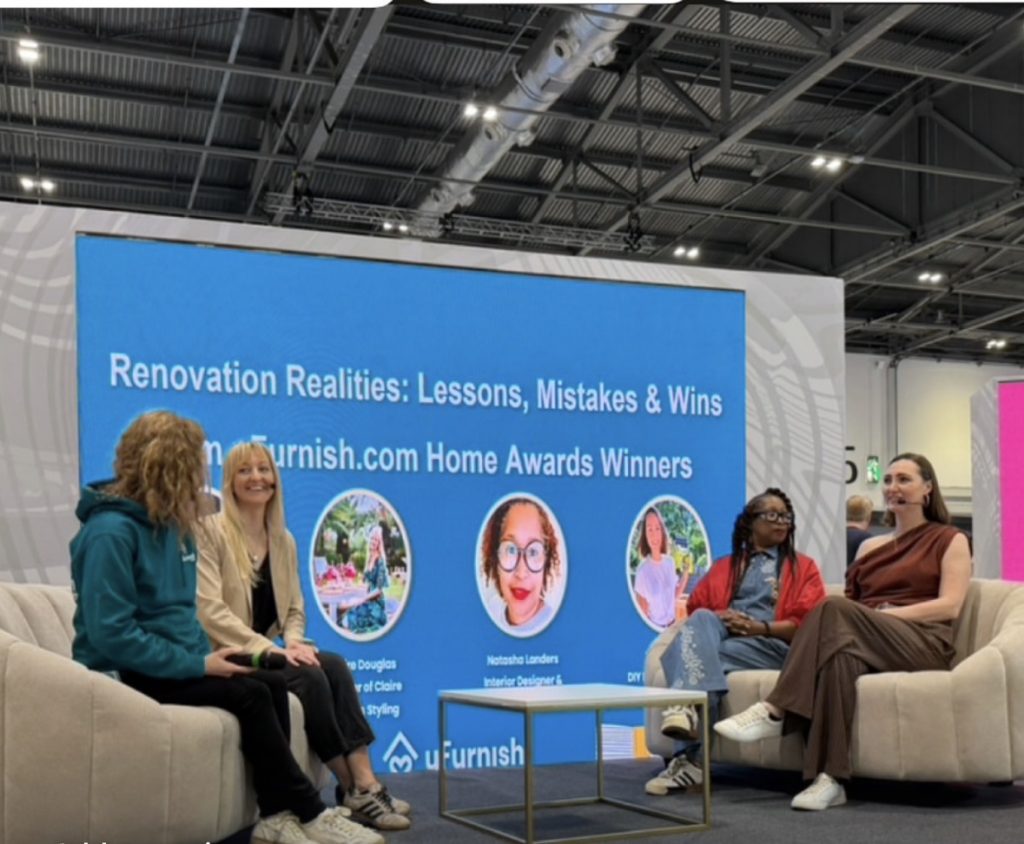 claire douglas talking on a panel at Grand Designs London Live